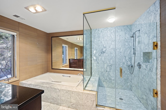 bathroom with independent shower and bath