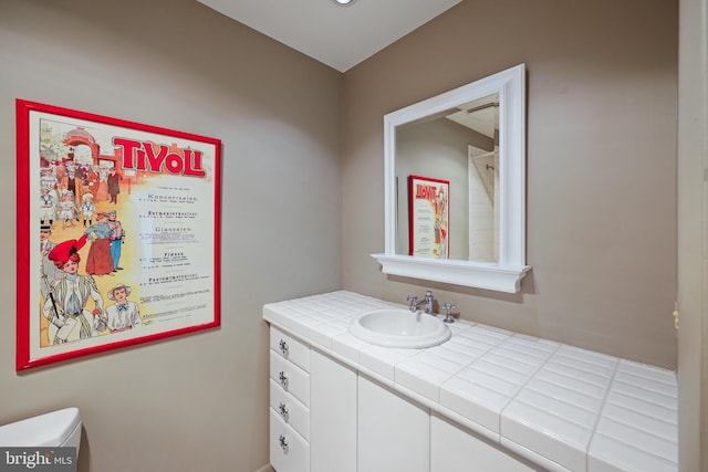 bathroom with vanity and toilet