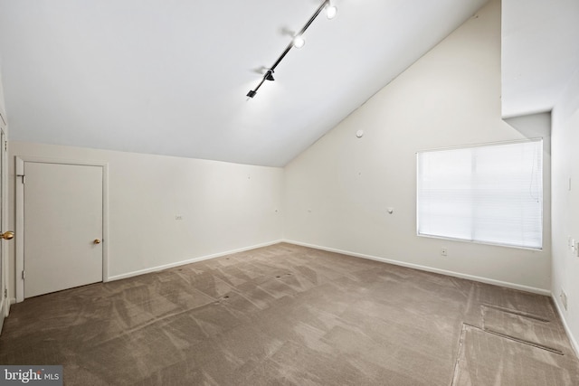 bonus room with lofted ceiling and carpet