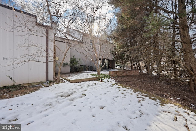 view of yard covered in snow