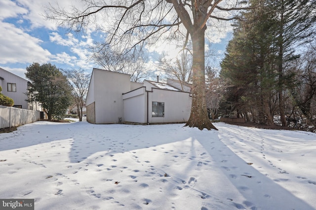 view of snow covered house