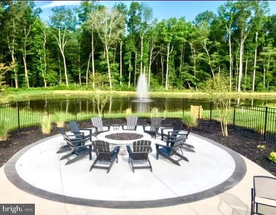 view of patio with a water view