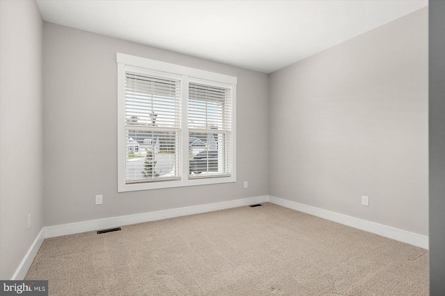 unfurnished room featuring carpet floors