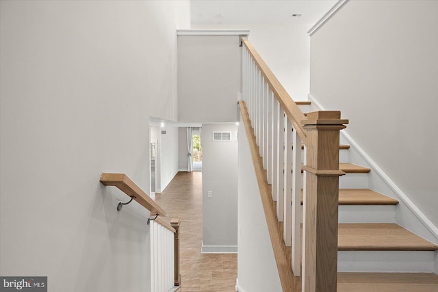 stairs featuring a high ceiling