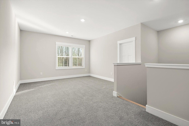 unfurnished room featuring carpet