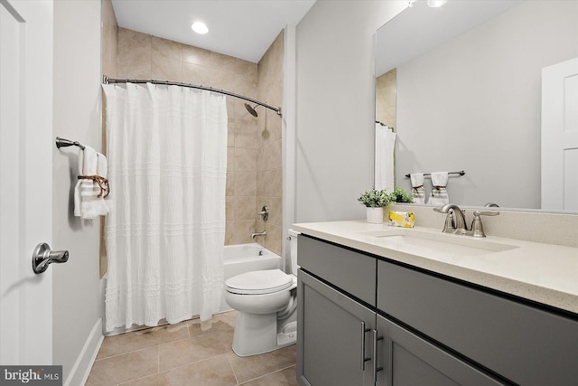 full bathroom with toilet, shower / bathtub combination with curtain, tile patterned floors, and vanity