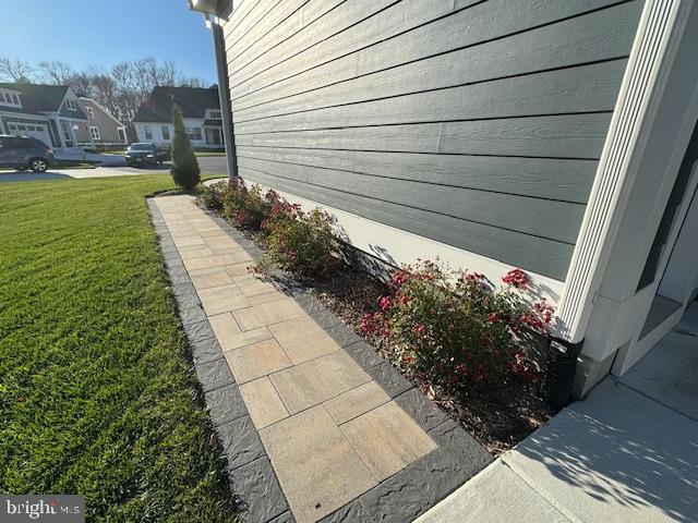 view of home's exterior with a lawn