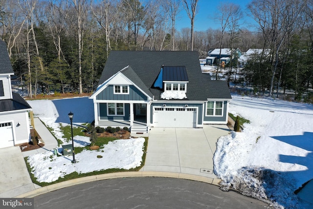 view of front of house with a porch and a garage