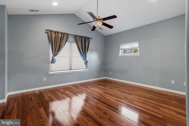 spare room featuring hardwood / wood-style flooring, ceiling fan, and lofted ceiling