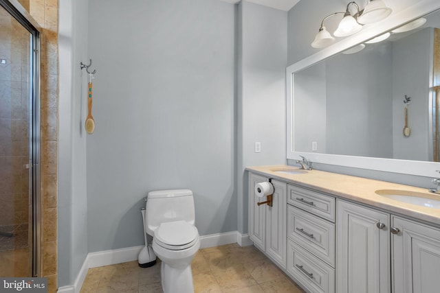 bathroom with tile patterned flooring, vanity, toilet, and walk in shower