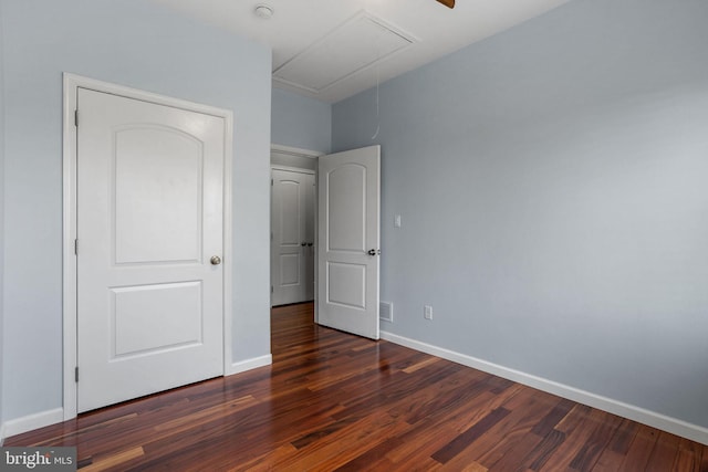 unfurnished bedroom featuring dark hardwood / wood-style floors