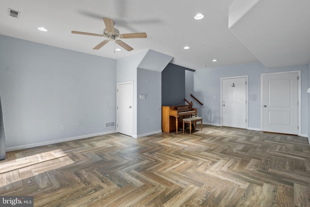 interior space featuring dark parquet floors and ceiling fan