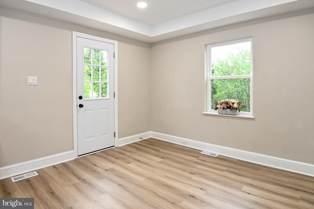 empty room featuring baseboards, wood finished floors, and recessed lighting