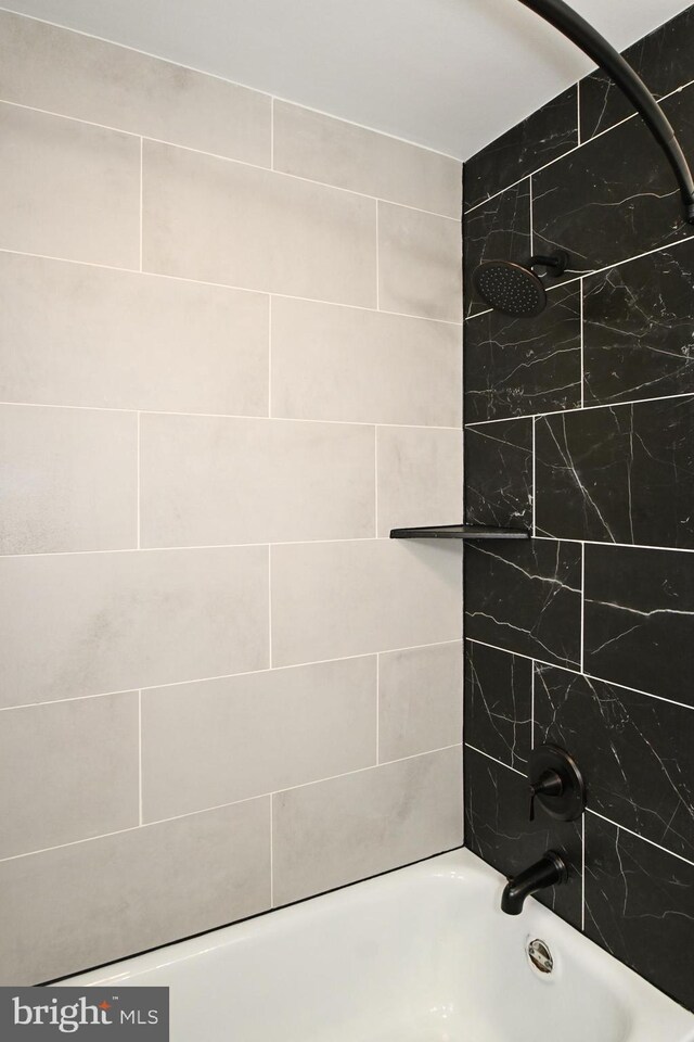 full bathroom featuring  shower combination