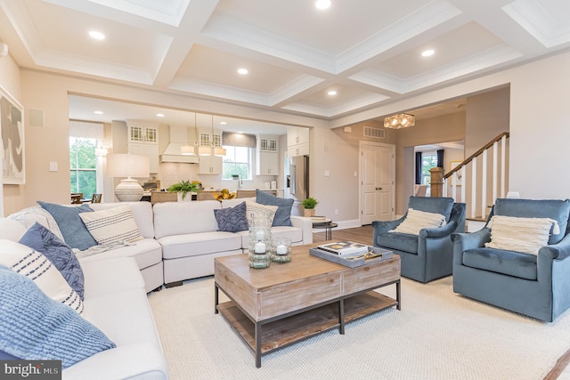 living room featuring beam ceiling, crown molding, and coffered ceiling