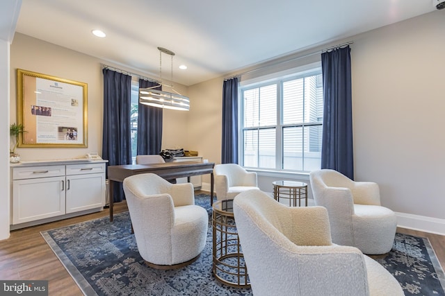 interior space with a chandelier and hardwood / wood-style floors