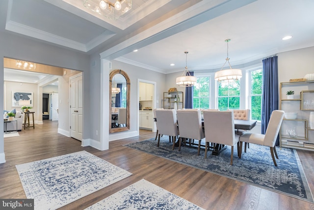 dining space featuring dark hardwood / wood-style flooring and crown molding