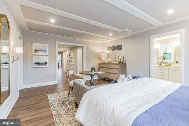 bedroom with dark wood-type flooring and ensuite bath