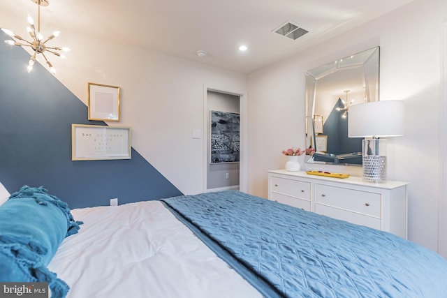 bedroom with an inviting chandelier