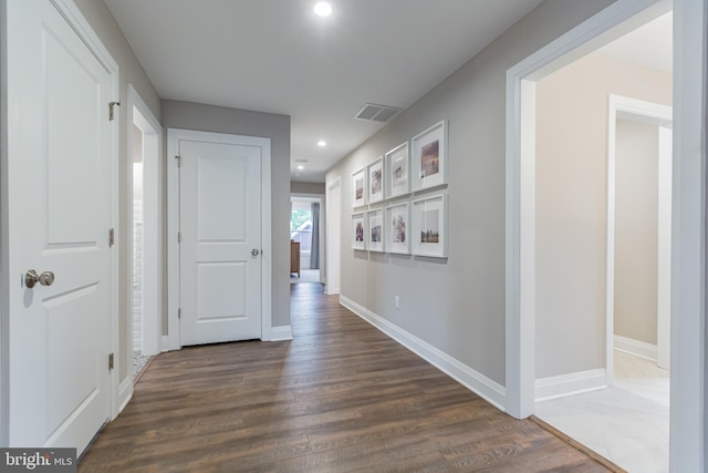 hallway featuring dark hardwood / wood-style flooring