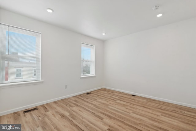 spare room with light wood-type flooring