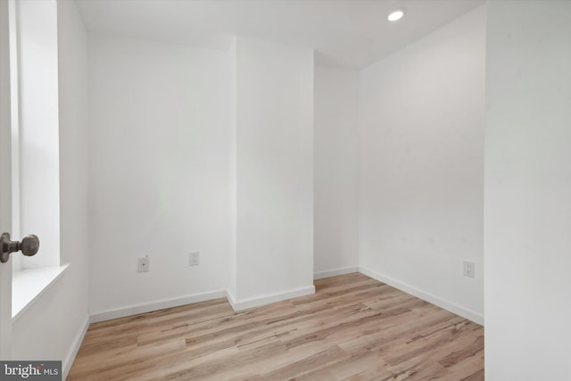 unfurnished room featuring light wood-type flooring