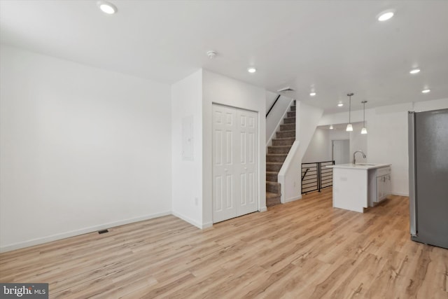 interior space featuring light hardwood / wood-style floors and sink