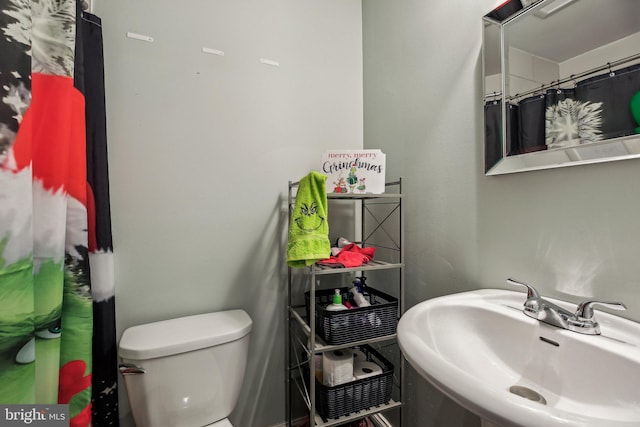 bathroom with sink and toilet