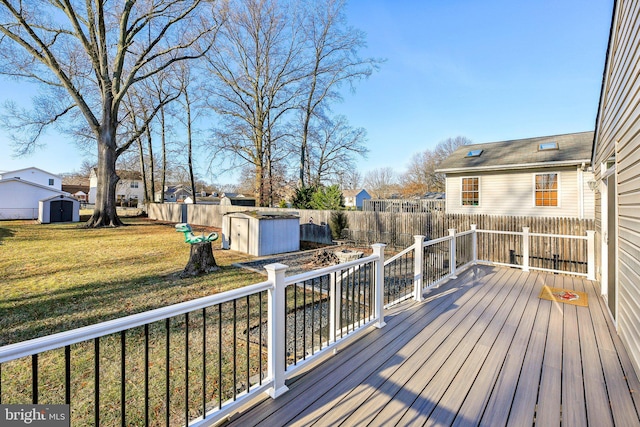 wooden terrace featuring a yard and a storage shed