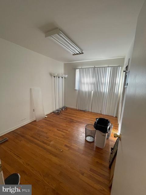 spare room featuring hardwood / wood-style flooring