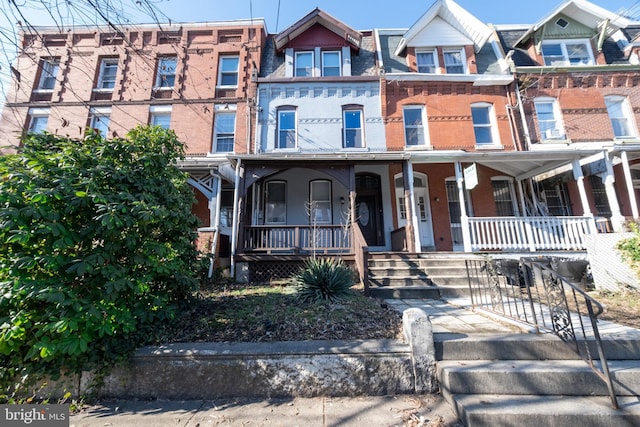 multi unit property featuring a porch