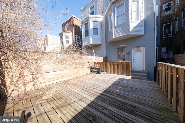 wooden deck featuring central AC unit