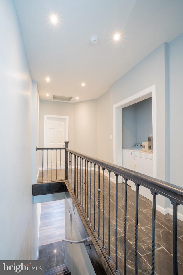 corridor with washer and dryer