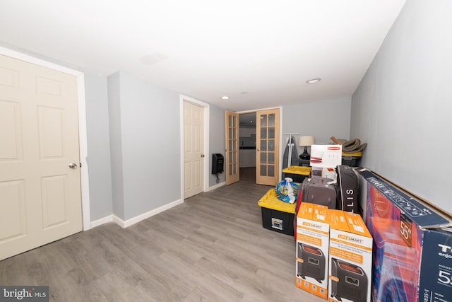 recreation room featuring light hardwood / wood-style floors