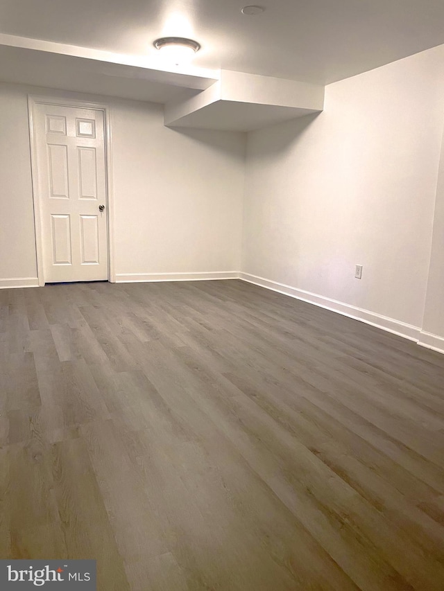 basement featuring hardwood / wood-style floors