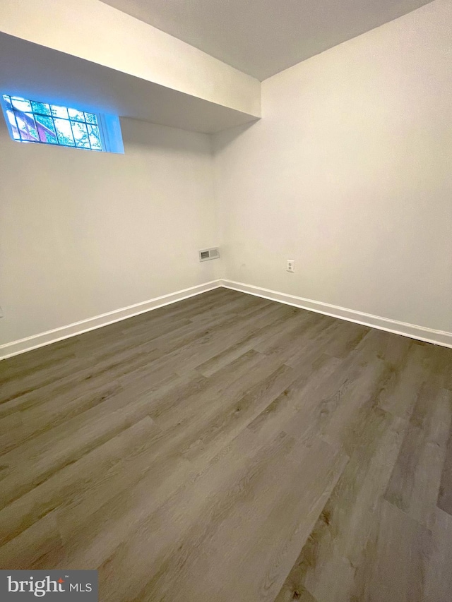 washroom with dark wood-type flooring