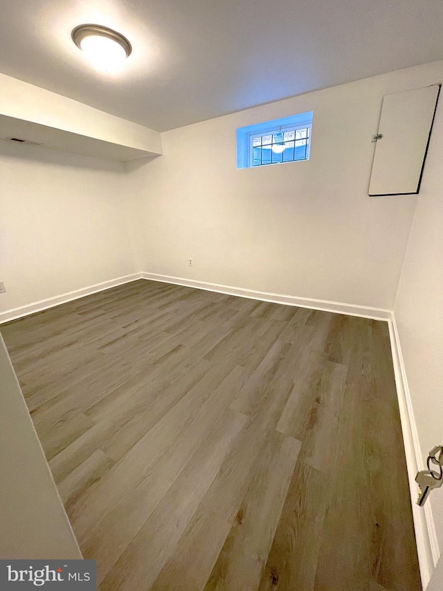 basement with wood-type flooring