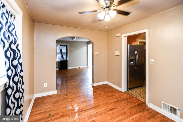 interior space featuring ceiling fan and wood-type flooring