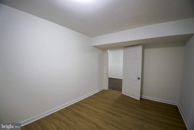 interior space with wood finished floors and baseboards