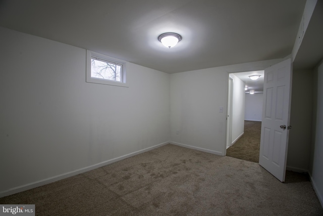 below grade area with carpet floors and baseboards