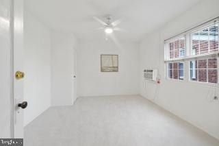 spare room with ceiling fan