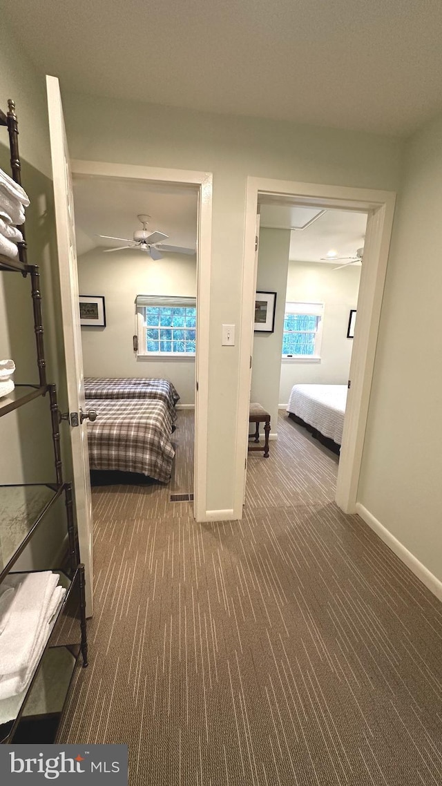 carpeted bedroom featuring ceiling fan