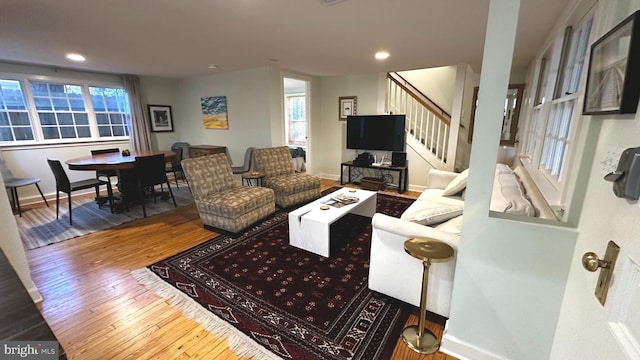 living room with hardwood / wood-style flooring and a wealth of natural light