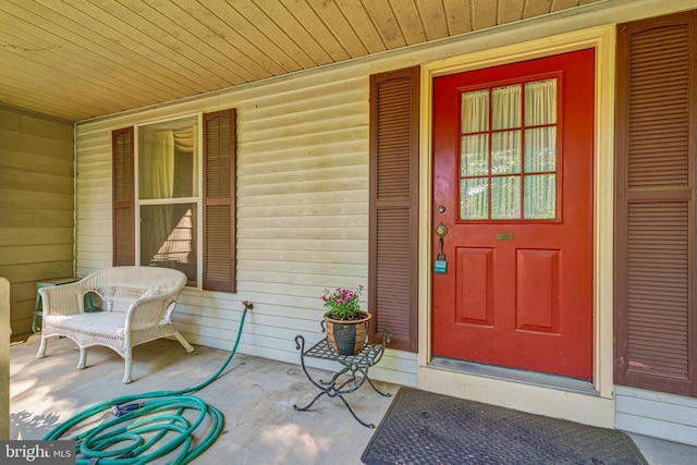 view of exterior entry featuring a porch