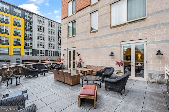 view of patio with an outdoor living space and french doors