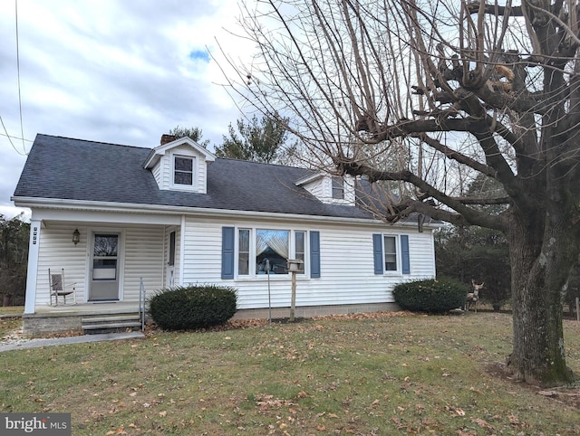 cape cod home featuring a porch and a front yard