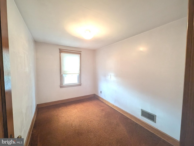 unfurnished room featuring carpet