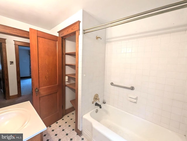 bathroom with vanity and tiled shower / bath combo