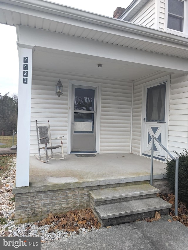 property entrance featuring covered porch