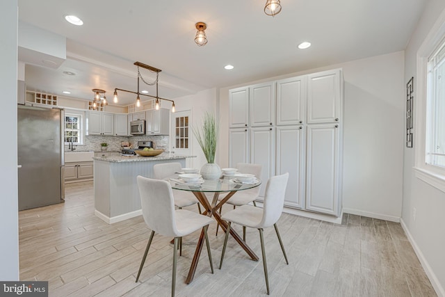 dining room with light wood-type flooring